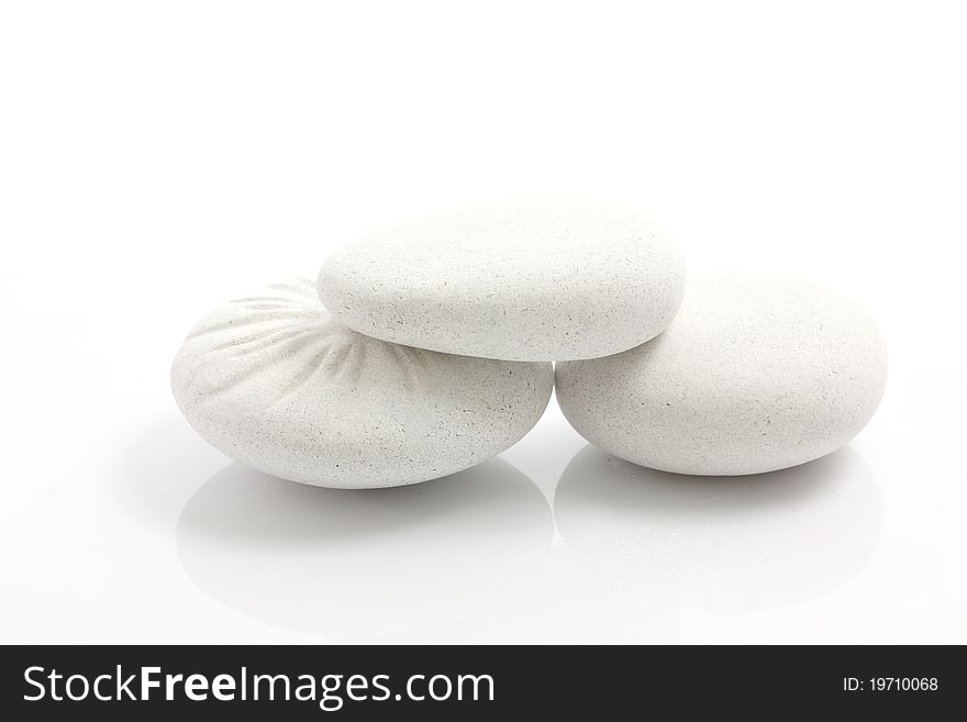 Abstract background round pebble stones isolated in white background