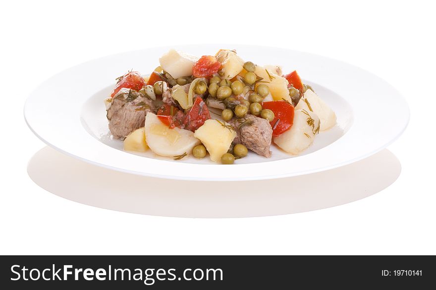 Potatoes with meat and vegetables, isolated on white background