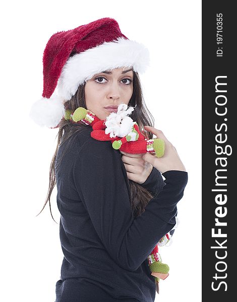 A beautiful woman with christmas hat with funny santa claus dolls