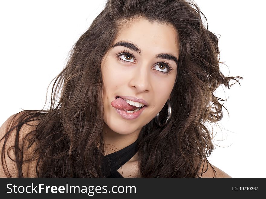 A young woman doing funny face with her tong out