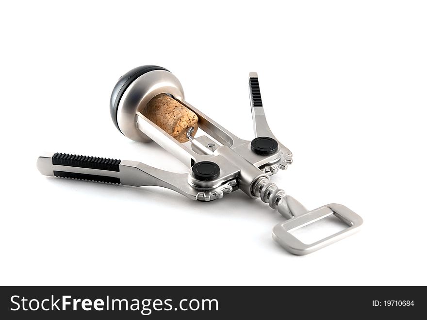 Corkscrew with cork from wine isolated over white