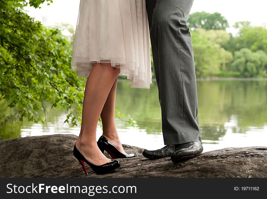 Romantic couple standing on a rock in Central Park