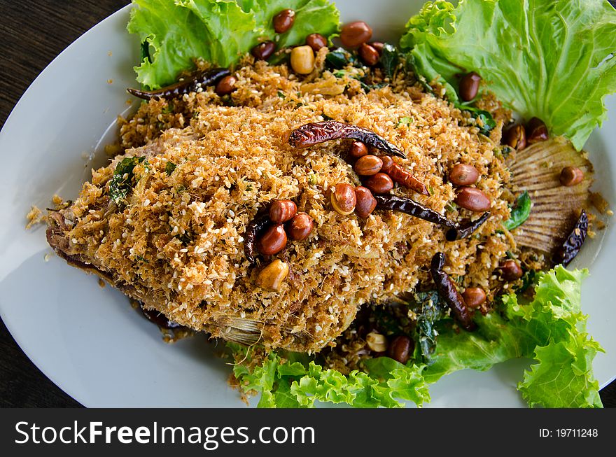 Fried fish topped with herbs. Fried fish topped with herbs.