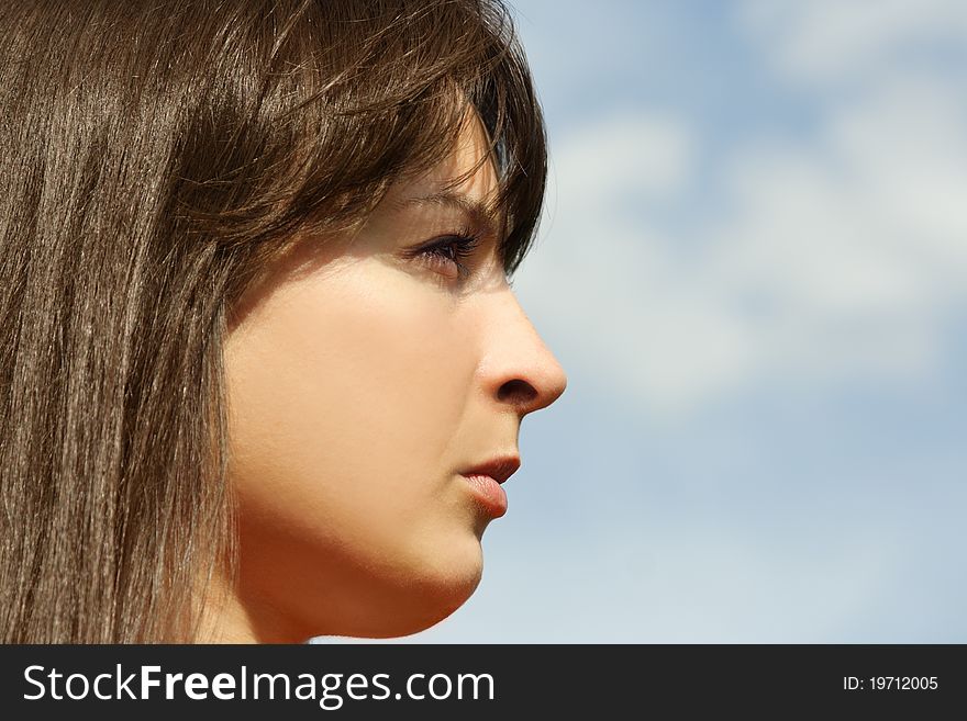 Young Brunette Girl, Blue Sky