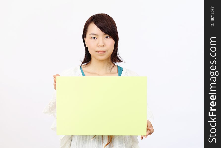 Portrait Of Young Woman Holding Blank Board