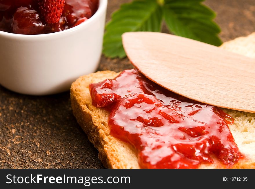 Wild strawberry jam with toast. sweet breakfast