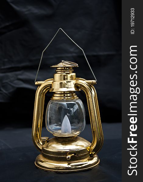 Old fashioned lantern in darkness. Light concept. Old fashioned lantern in darkness. Light concept.