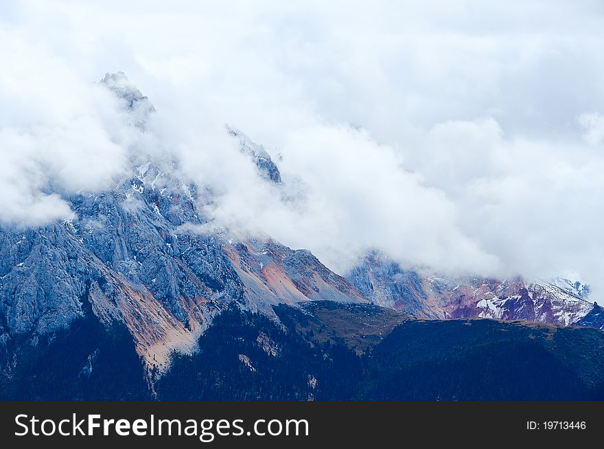 The cloud covered the mountain peak and the fog beautiful scenery. The cloud covered the mountain peak and the fog beautiful scenery