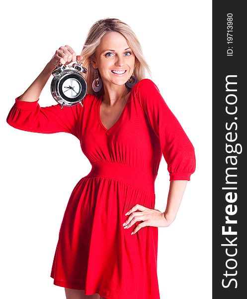 Beautiful happy young blond woman holding an alarm clock, isolated against white background. Beautiful happy young blond woman holding an alarm clock, isolated against white background
