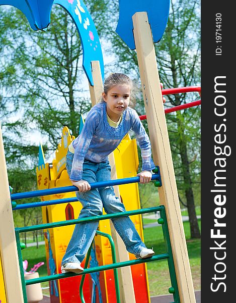 Girl Having Fun In Playground