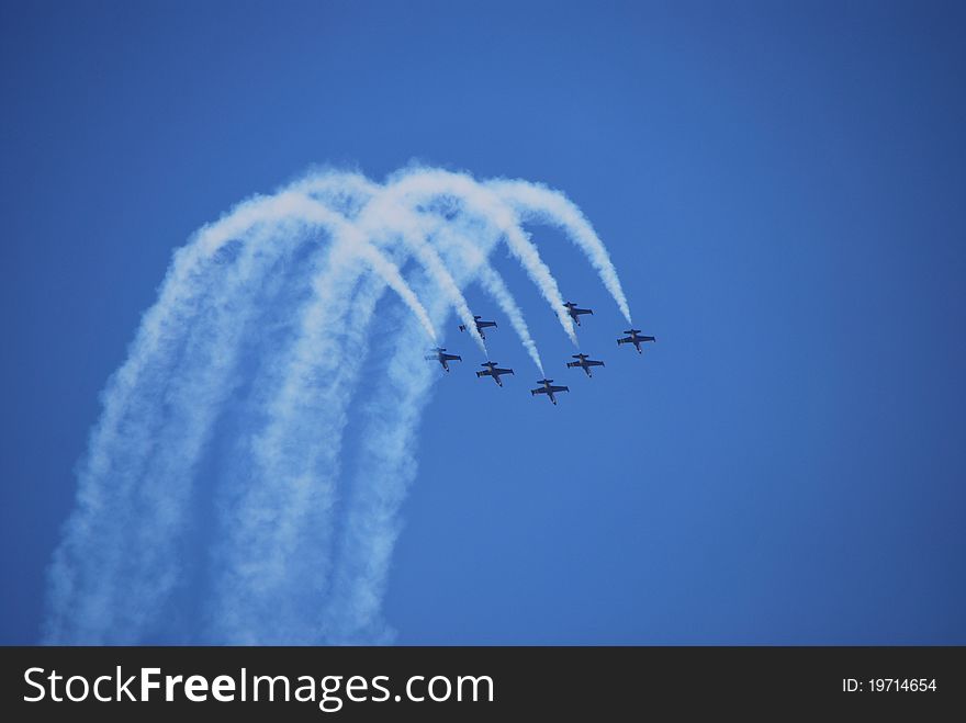 Aircraft formation flying show with produce fog. Aircraft formation flying show with produce fog