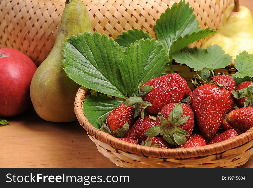 Ripe wild strawberry garden and green leaves. Ripe wild strawberry garden and green leaves.