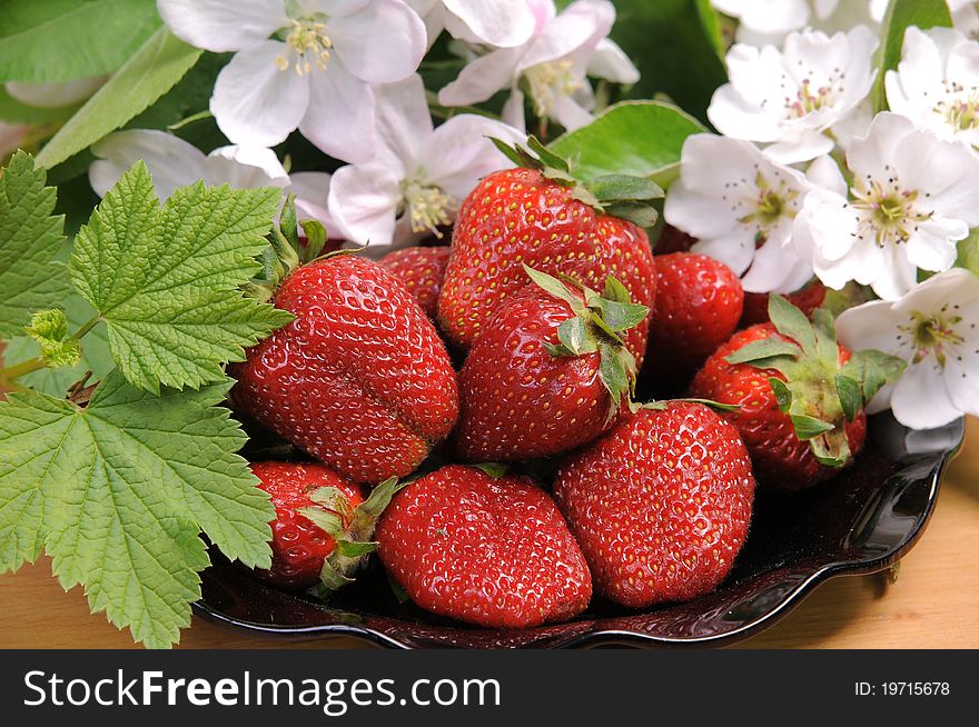 Ripe wild strawberry garden and green leaves. Ripe wild strawberry garden and green leaves.