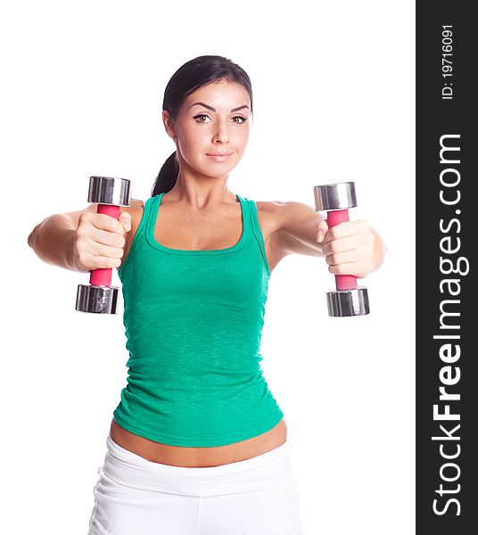 Beautiful young woman with dumbbells, isolated against white background