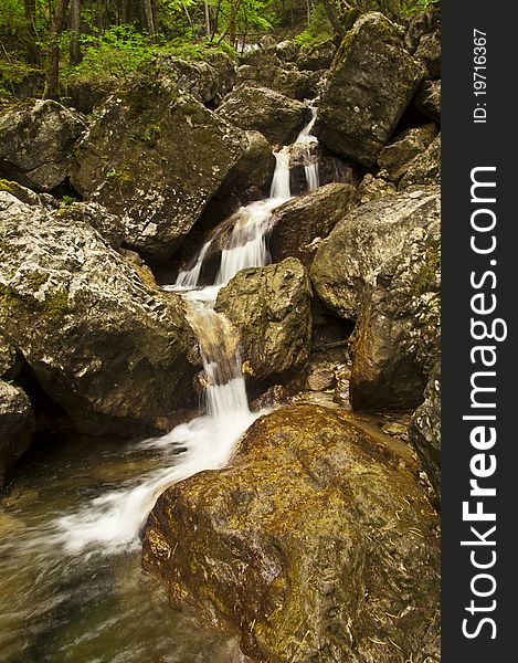 Photo of waterfalls in small river canyon. Photo of waterfalls in small river canyon