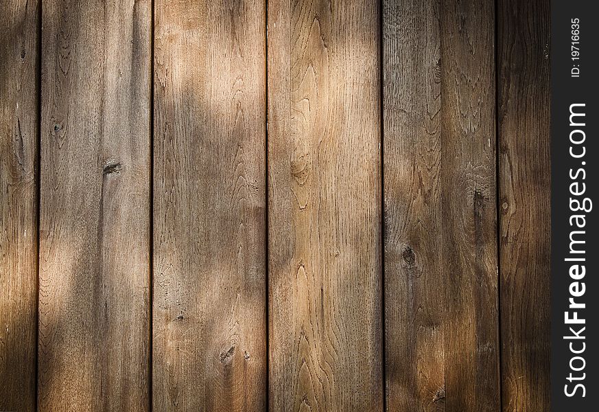 Play of lights on wooden wall background or texture. Play of lights on wooden wall background or texture