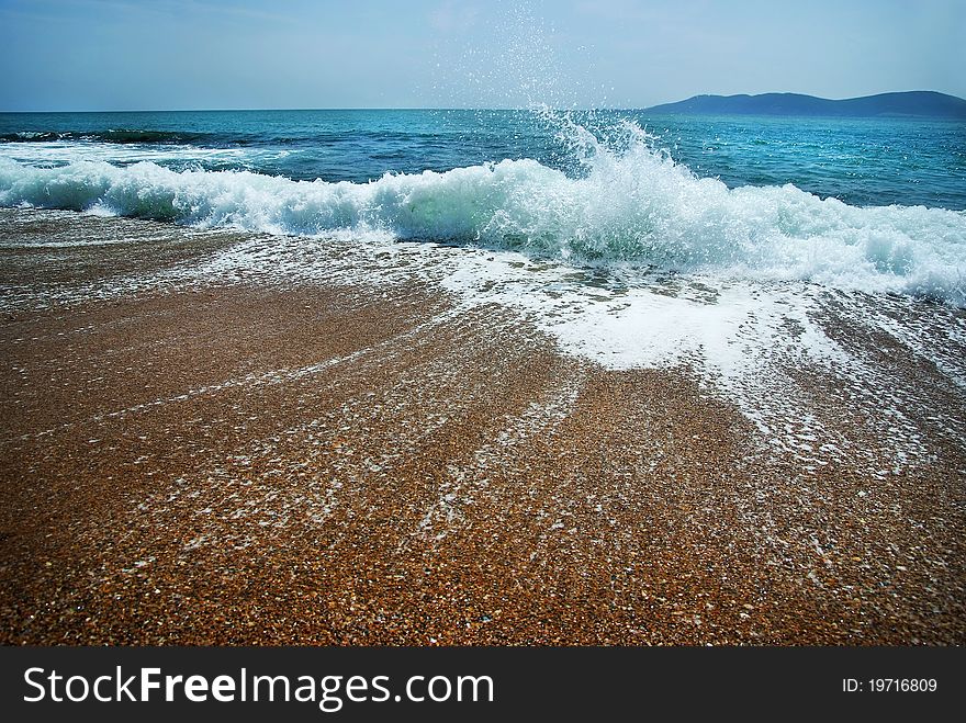 Blue wave on the sand sea beach
