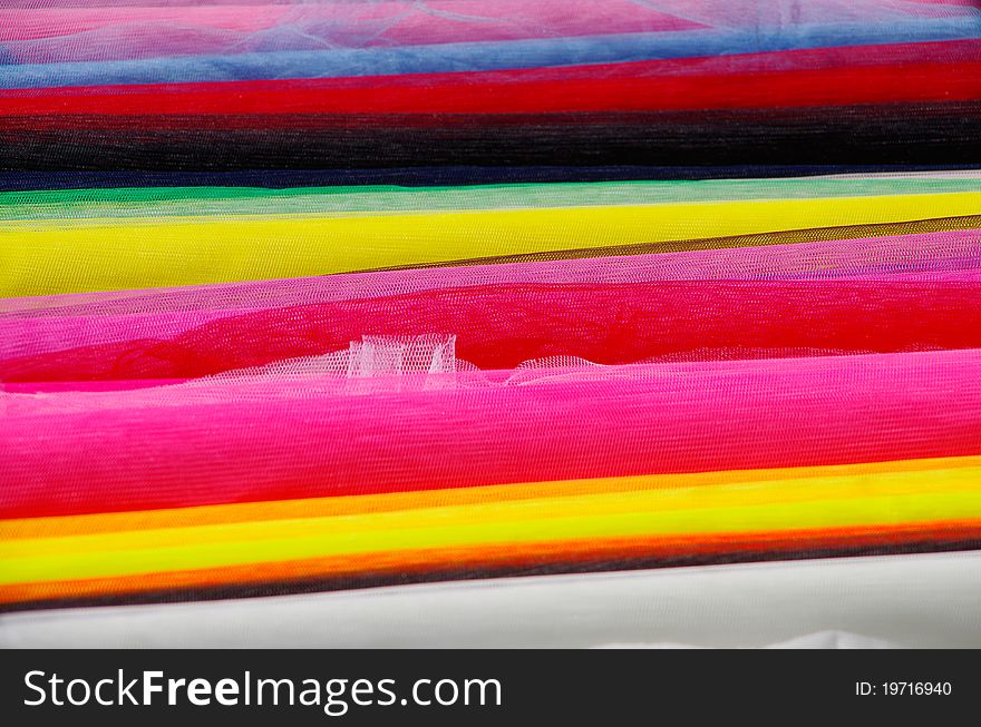 Colorful bales of cloths with gauze fabrics