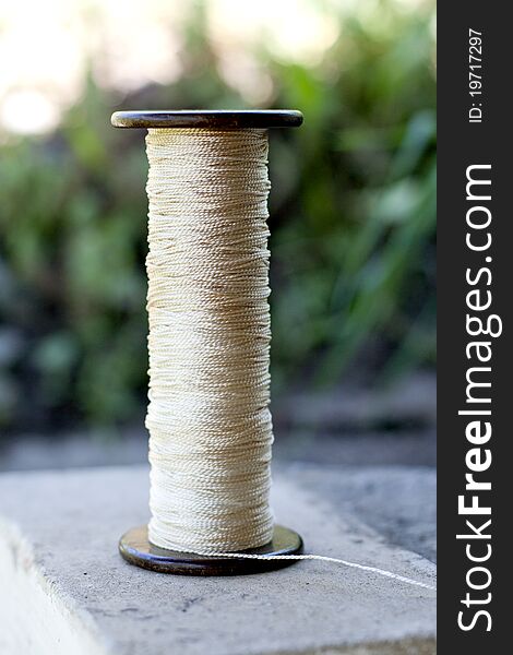 Large Reel of thread with a white, kapron filament