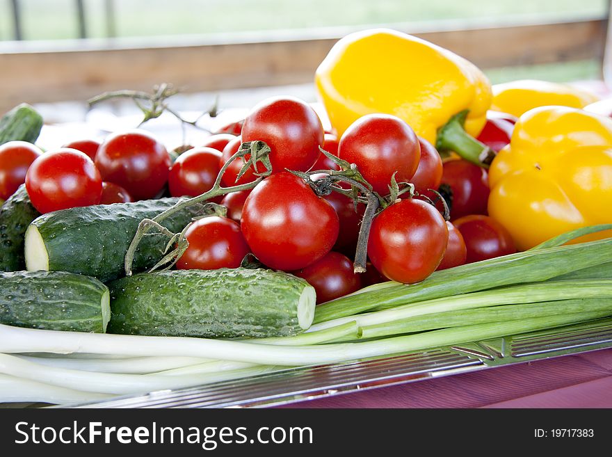 Full frame photograph of a broad variety of fruits and vegetables; colorful and plentiful. Full frame photograph of a broad variety of fruits and vegetables; colorful and plentiful