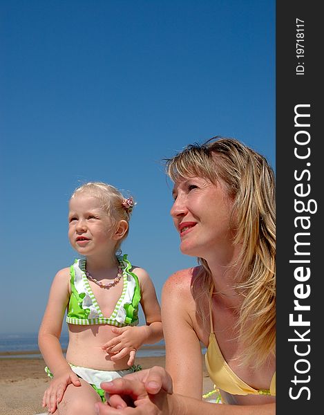 Woman And Little Girl On The Beach