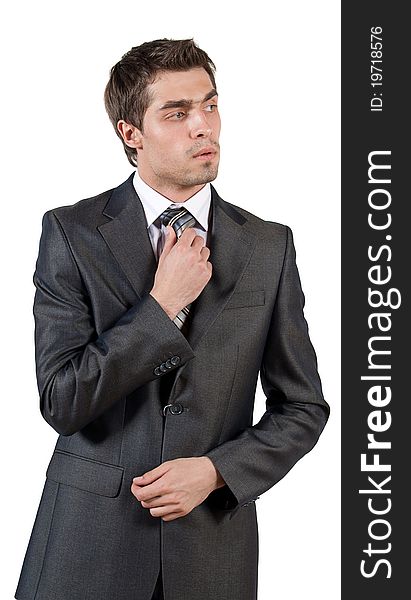 Portrait of a young elegant man in classical suit on isolated white background