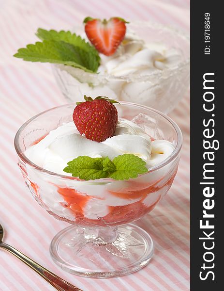 Dessert with cream and strawberries in portion bowl