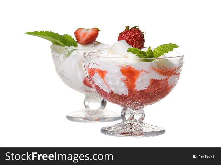 Dessert with cream and strawberries. Isolated over white