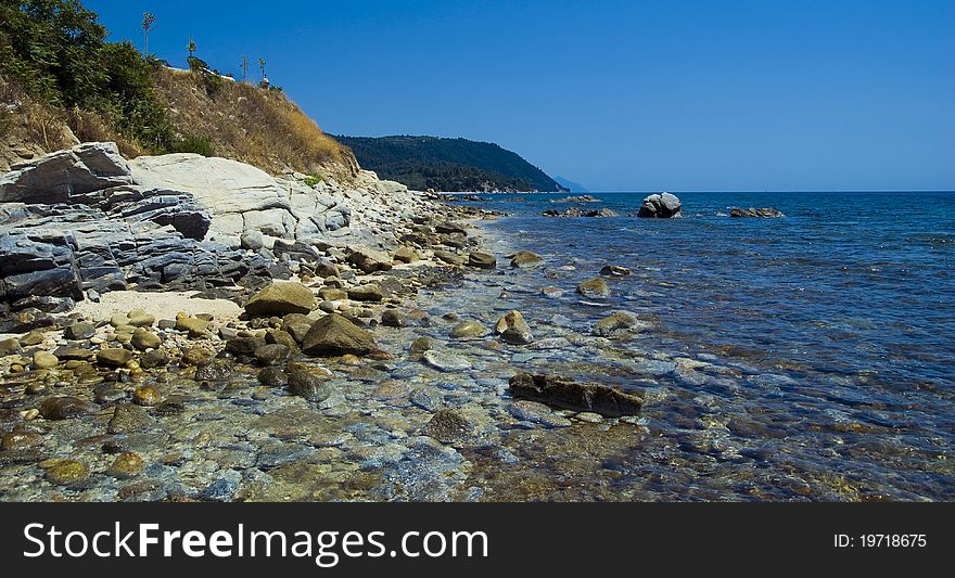 View of seaside with stones and mountains. View of seaside with stones and mountains