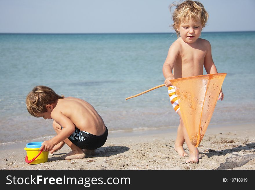 Two children playing on beach