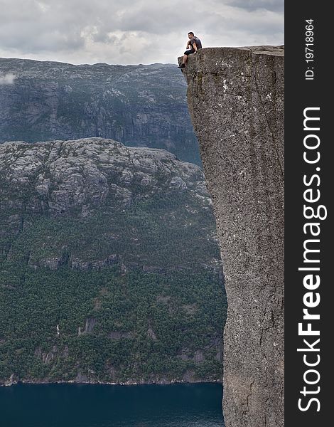 Man sitting on the rock. Norway. Man sitting on the rock. Norway.