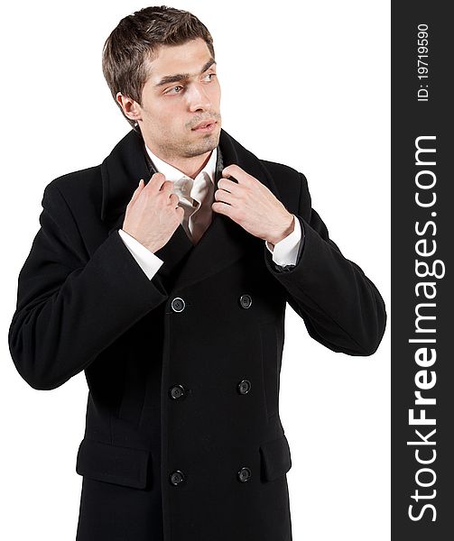 Portrait of elegant young man in black coat on a white isolated background. Portrait of elegant young man in black coat on a white isolated background