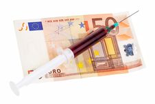 Syringe With Red Liquid On 50 Euro Banknote. Stock Photo