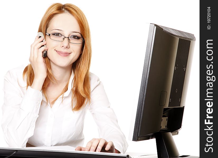 Smiling young business woman calling by phone. Studio shot.