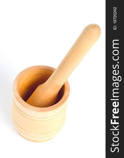 Wooden pounder and pestle on white