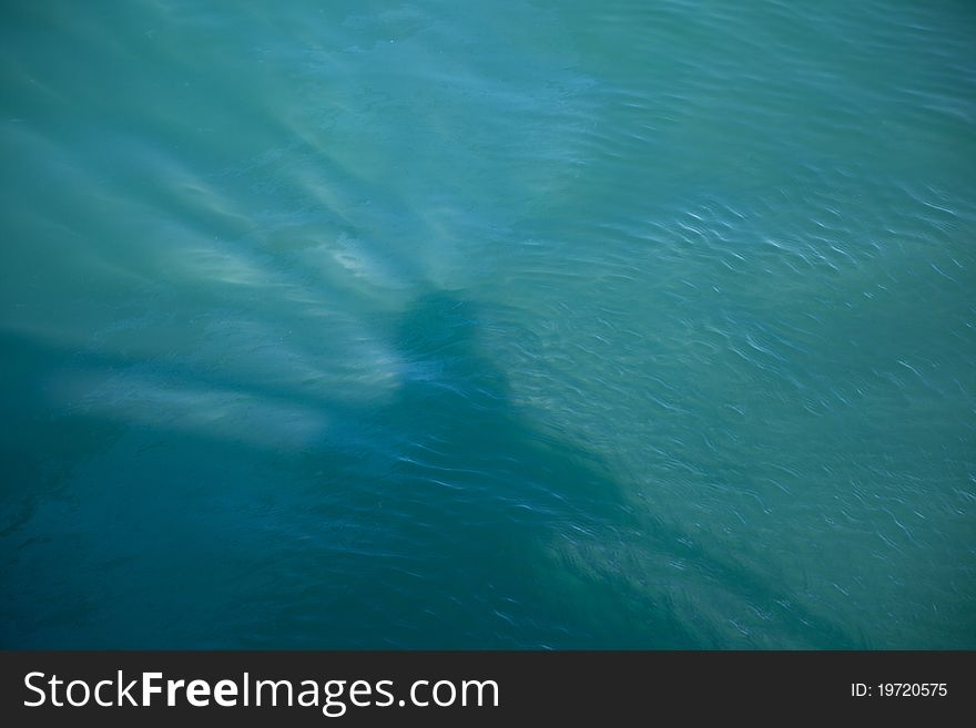 Shadow picture of a man on a boat