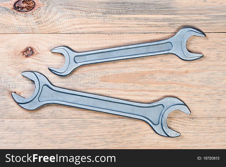 Wrenches On A Wooden Board.
