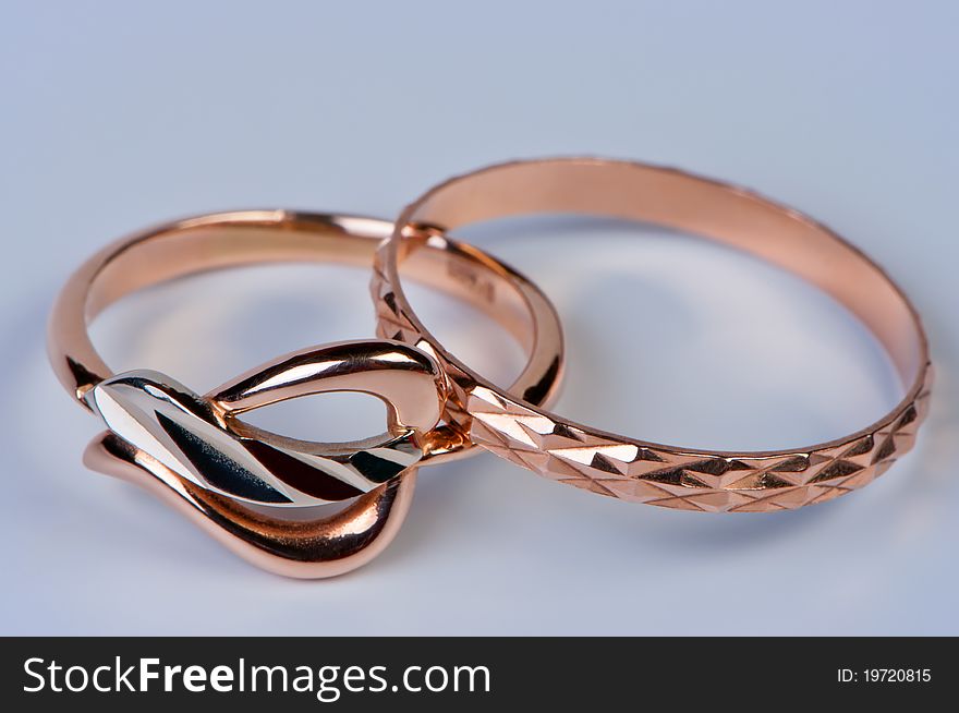 Two gold rings close up. Wedding jewelry. Macro photography.
