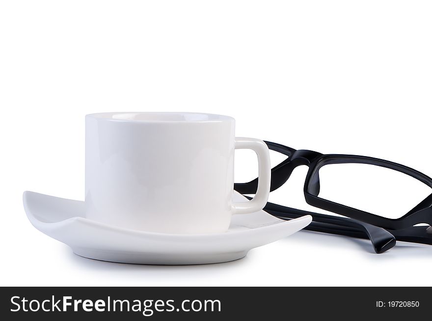 Eyeglasses and coffee cup. Objects isolated on white background shadow below.