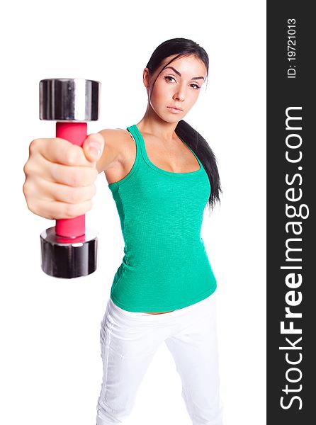 Beautiful young  woman with dumbbells, isolated against white background