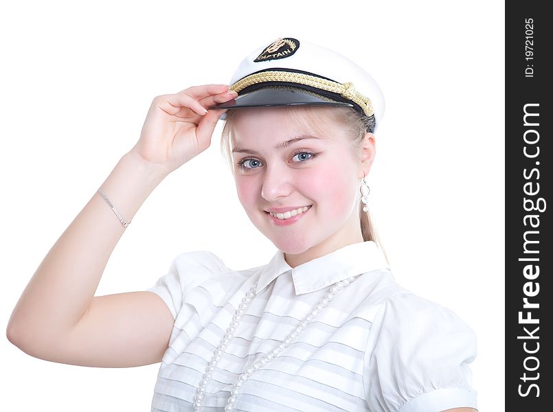 Beautiful girl in the captain's cap. Isolated on white background