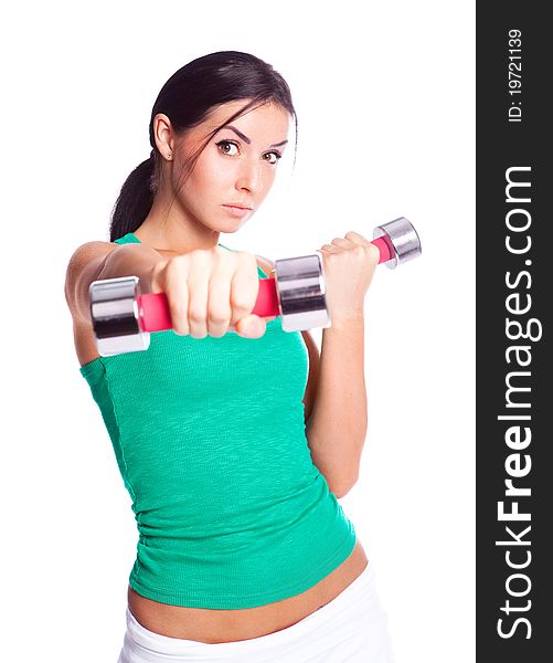 Beautiful young woman with dumbbells, isolated against white background