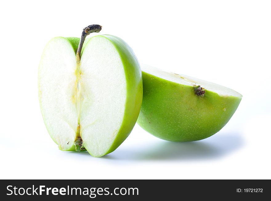 Two pieces green apple isolated on white background.