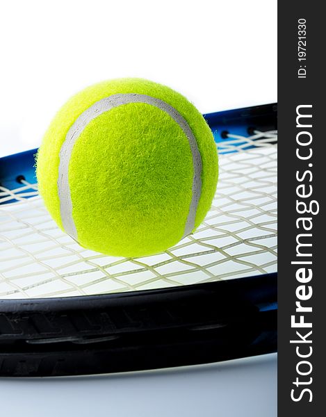 Tennis ball on racket and isolated on white background.