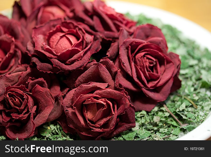 Dry red roses in a bowl. Dry red roses in a bowl