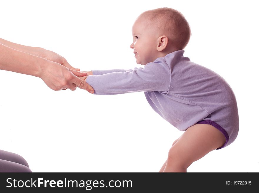 Smiling little girl holding mother hands and making gym