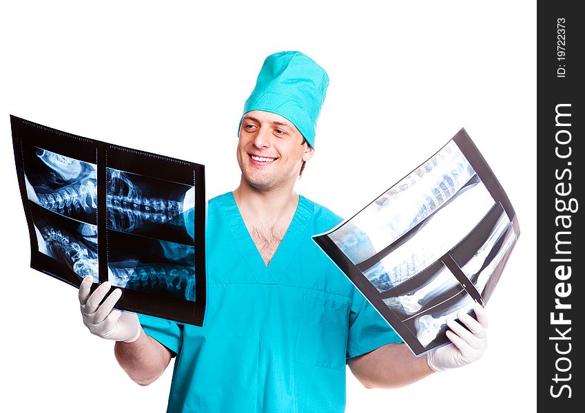 Portrait of a surgeon looking at the x-ray photographs. isolated on white background