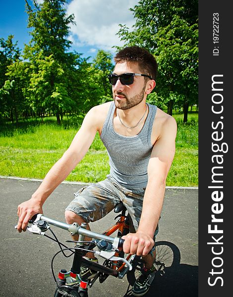 Young man cyclist sitting on bicycle