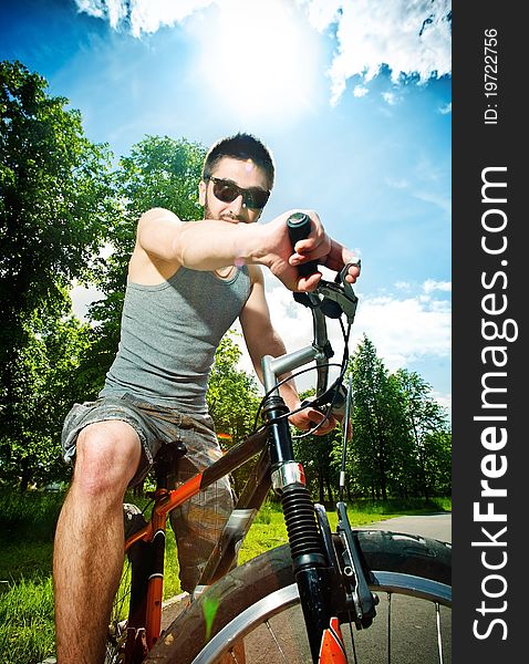 Young man cyclist sitting on bicycle