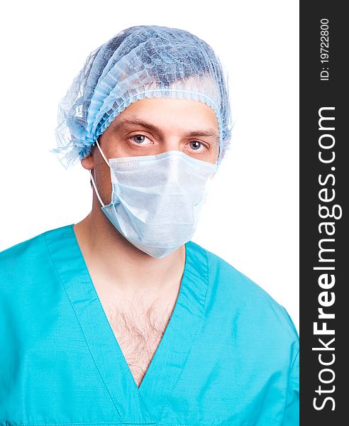 Portrait of a surgeon wearing a mask and green uniform. isolated on white background